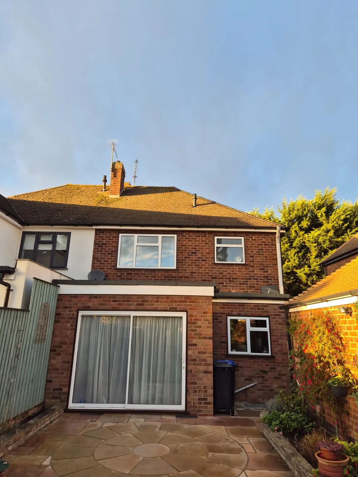 Rear exterior of a residential property with upper windows
